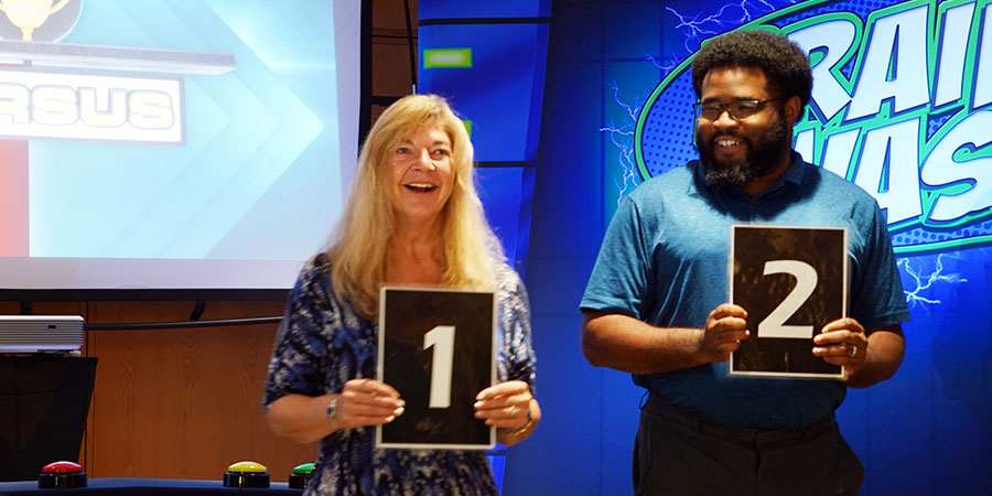 AMETEK Corporate office employees smile as they enjoy a game of trivia to benefit the United Way.